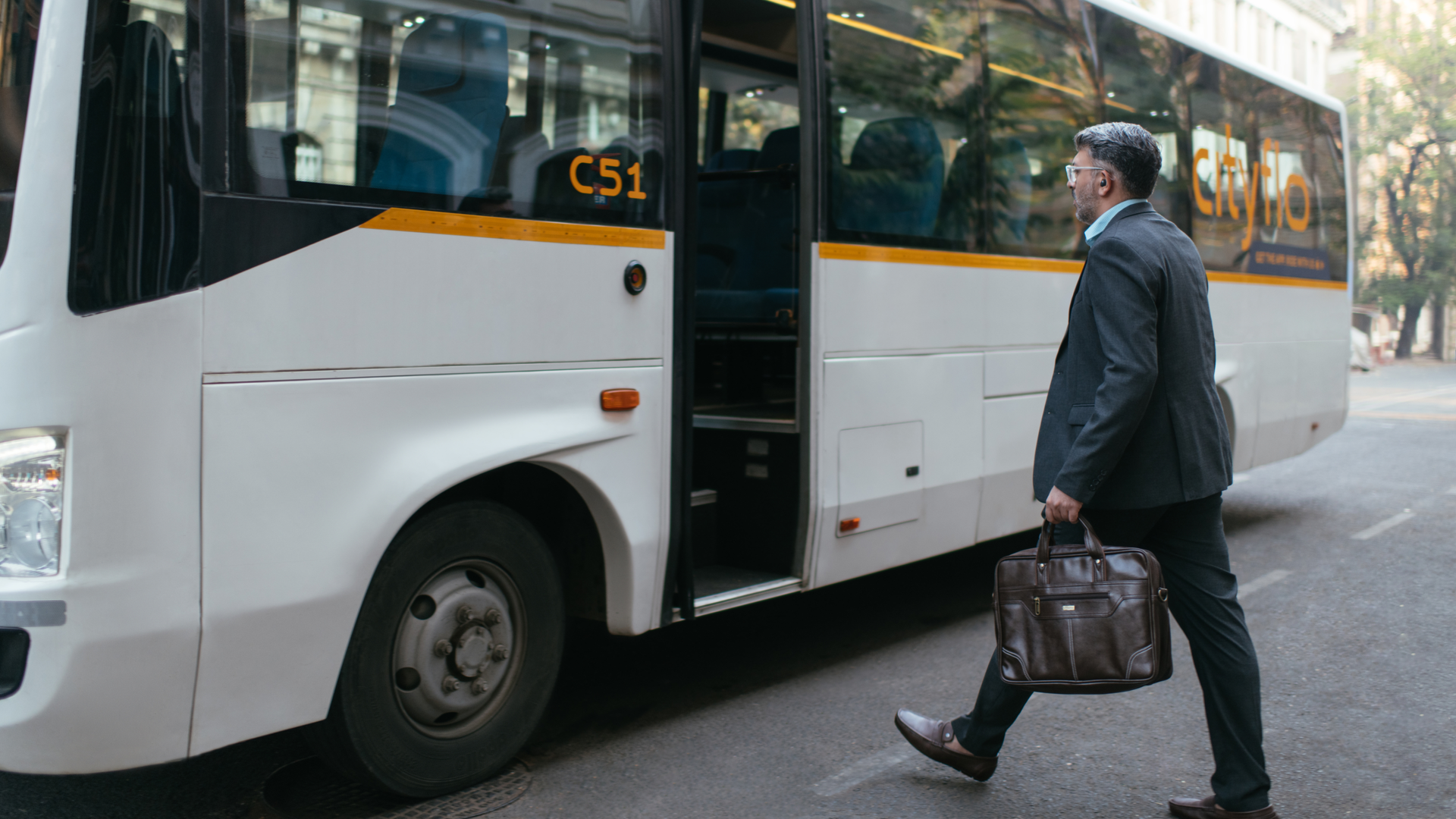 A Cityflo corporate bus with working professionals in Mumbai, on their way to Worli.